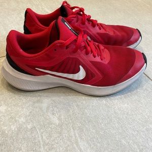 Youth size 6 red Nike sneakers , see photos for wear details
